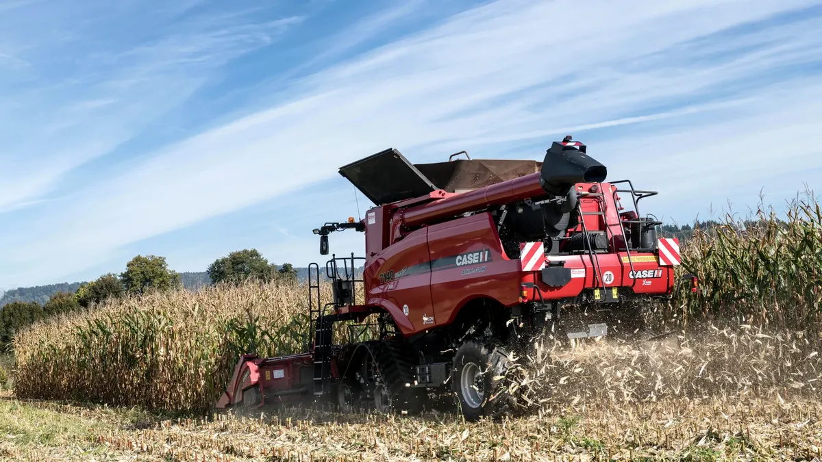 Forage harvester in a cornfield during harvest time in Höxter, Germany.